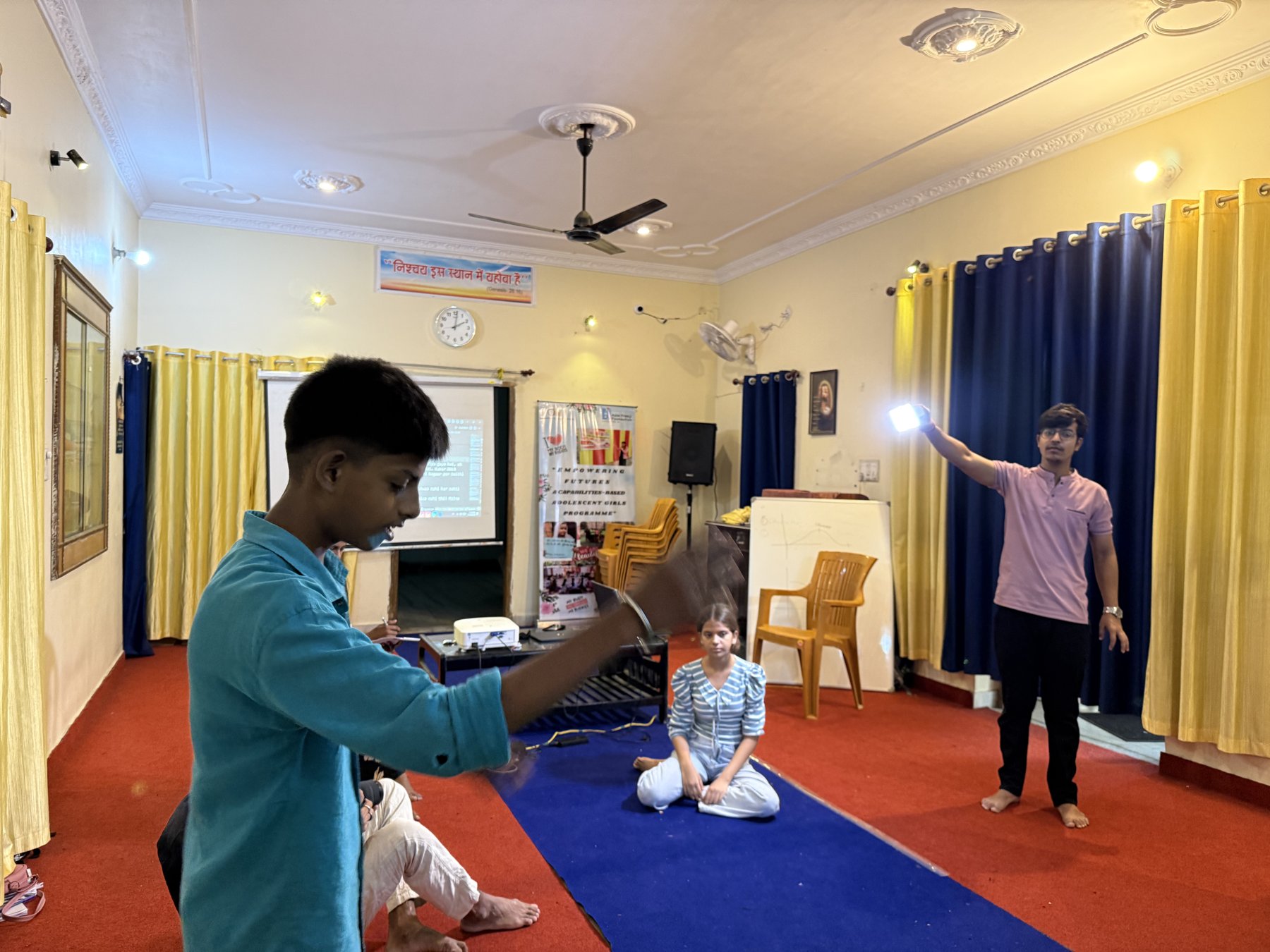 A participant practising with a camera at the Deeksha Foundation workshop